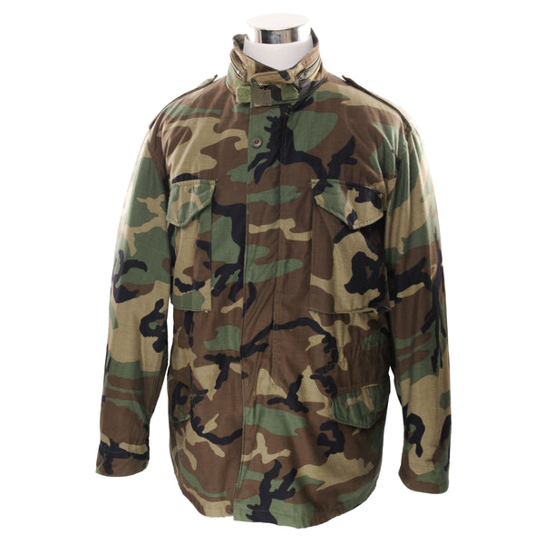 Vintage US Army M-1965 M65 Woodland Camouflage Pattern Field Jacket 1984 Size Large Regular With Liner  STOCK NO. 8415-01-099-7838  DLA 100-84-C-0755  The M-65 field jacket was widely used by United States forces during the Vietnam War and became a classic used by the U.S. troops in several other wars all around the world. 