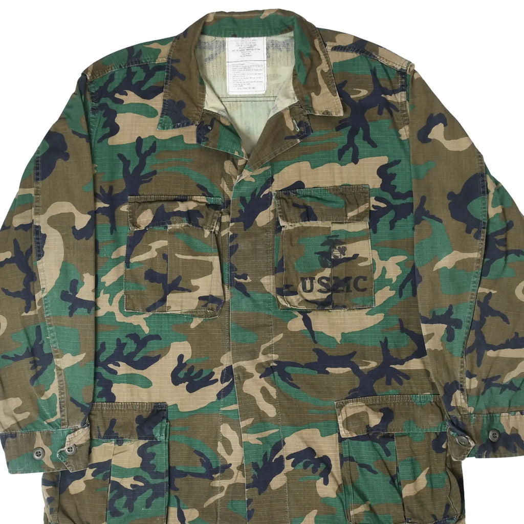 Front detail of USMC woodland hot weather coat with four pockets and USMC chest stencil