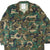 Front detail of USMC woodland hot weather coat with four pockets and USMC chest stencil