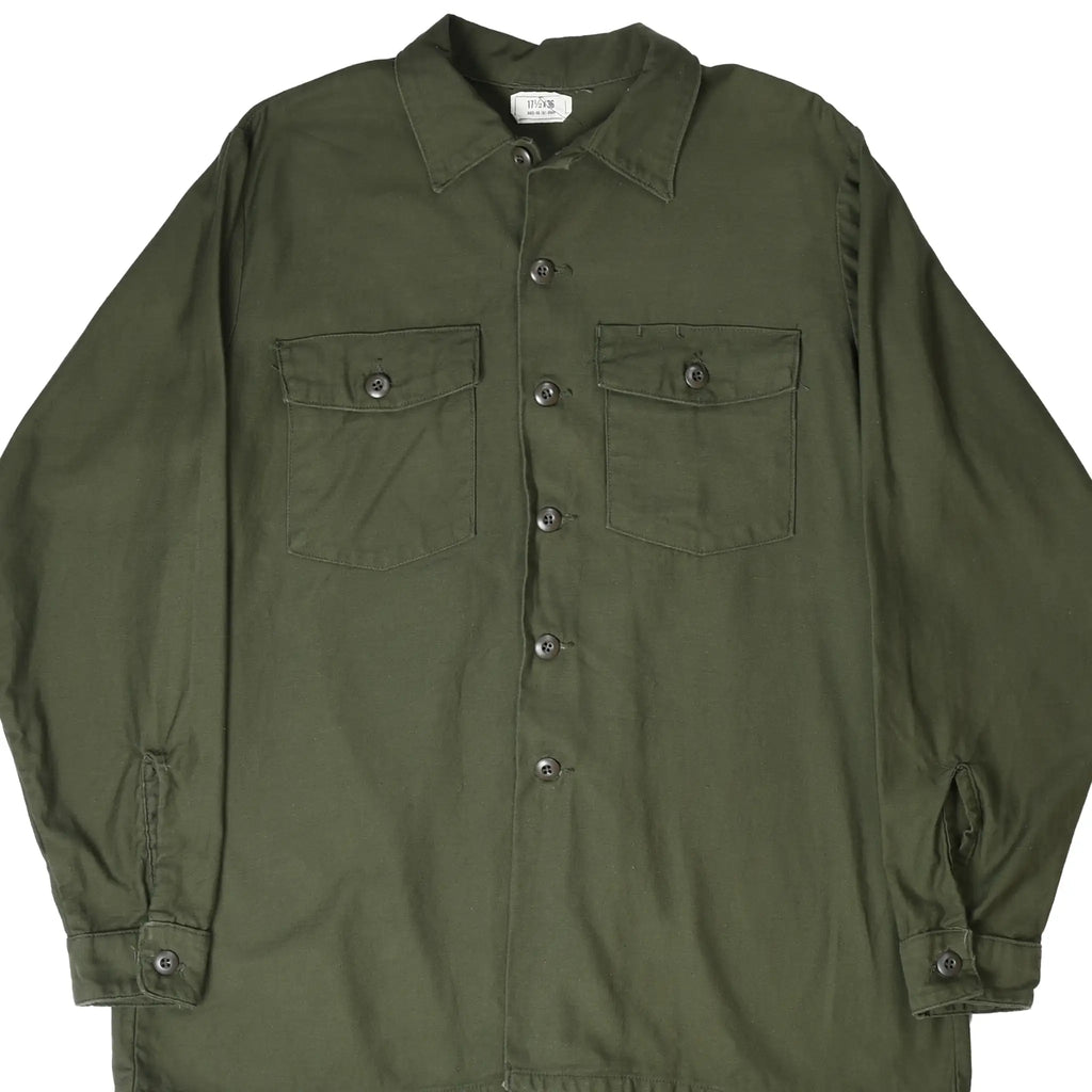 Front view of US Army OG-107 utility sateen shirt with button closure and two flap chest pockets