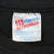 Close-up of Hanes Activewear neck label inside the black sweatshirt.