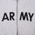 Close-up of black ARMY chest print divided by the front zipper on gray hoodie