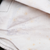 Faded inspection stamp on the white interior lining of US Army M51 wool field trousers