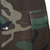 Close-up of woodland ripstop fabric and rectangular pocket flap on US Army combat trousers