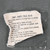 Close-up of worn M65 field jacket care instruction label
