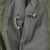 Close-up of M65 field jacket interior drawcord loops with metal ends