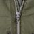 Close-up of the M65 field jacket front metal zipper and pull