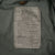 Close-up of the US Army M65 field jacket specification and care label