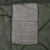 Close-up of the green cold weather coat liner specification and care label
