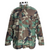 Front view of US Army M65 Woodland camo field jacket with stand collar and four flap pockets