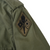 Close-up of Signal Training School patch on the US Army field jacket sleeve