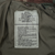 Inside spec label for Medium Long US Army M65 woodland camo field jacket, stock no. 8415-01-099-7836.
