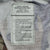 Interior spec and care label for woodland camouflage pattern combat trousers