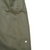 Close-up of olive drab overcoat fabric below a pocket, with a small marked blemish