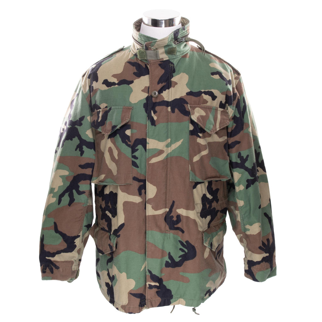 Vintage US Army M-1965 M65 Woodland Camouflage Pattern Patched Field Jacket 1996 Size Large Regular Nos Deadstock

STOCK NO. 8415-01-099-7838

SP0100-96-D-0320