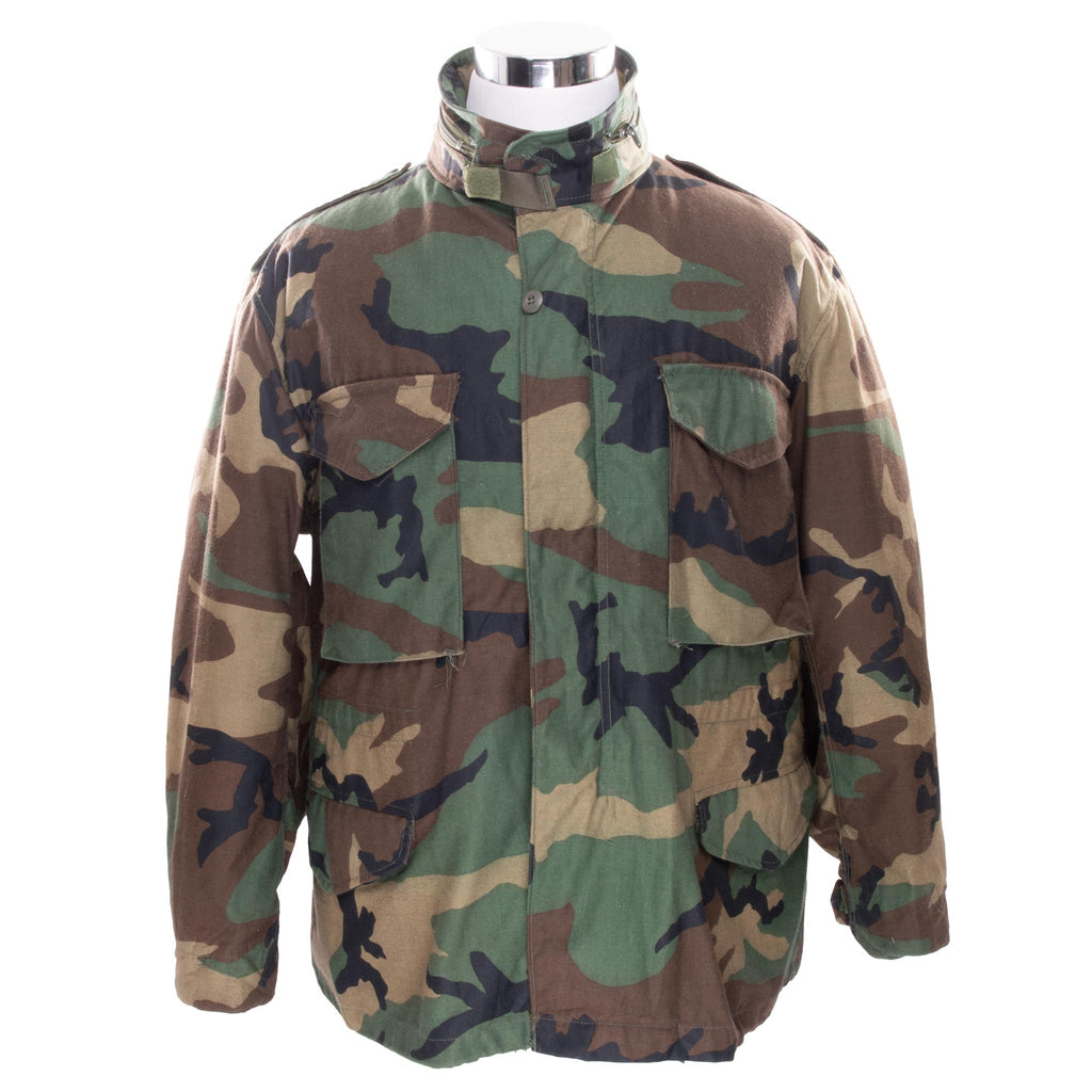 Vintage US Army M-1965 M65 Woodland Camouflage Pattern Patched Field Jacket 1983 Size Large Regular Nos Deadstock

STOCK NO. 8415-01-099-7838

DLA100-83-C-0424