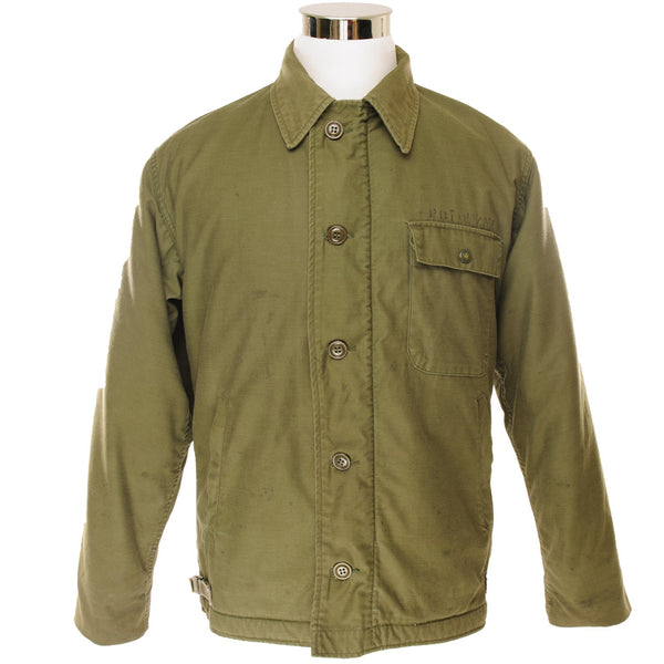 Vintage USN US Navy A-2 A2 Deck Jacket Cold Weather 1985 Size Medium (38-40).  This A2 a Jacket from 1985 was owned by one of the crew members of the CVN 72. This Nuclear Powered Aircraft Carrier also known as USS Abraham Lincoln was deployed in 1989 serving in South East Asia, and later on in the Middle East.  Stock No. 8415-00-753-5612 DLA100-85-C-0507
