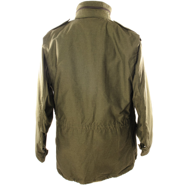 The M-65 field jacket was widely used by United States forces during the Vietnam War and became a classic used by the U.S. troops in several other wars all around the world.   The M-1965 jacket was initially designed by Alpha Industries and was made from OG-107 (Olive Green Shade 107) water repellent and wind resistant cotton-nylon sateen. The fabrics was made by Burlington Fabrics.