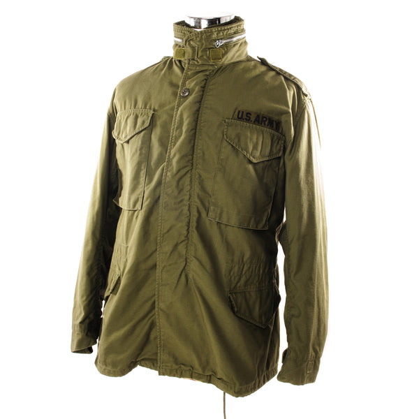 The M-65 field jacket was widely used by United States forces during the Vietnam War and became a classic used by the U.S. troops in several other wars all around the world.   The M-1965 jacket was initially designed by Alpha Industries and was made from OG-107 (Olive Green Shade 107) water repellent and wind resistant cotton-nylon sateen. The fabrics was made by Burlington Fabrics.