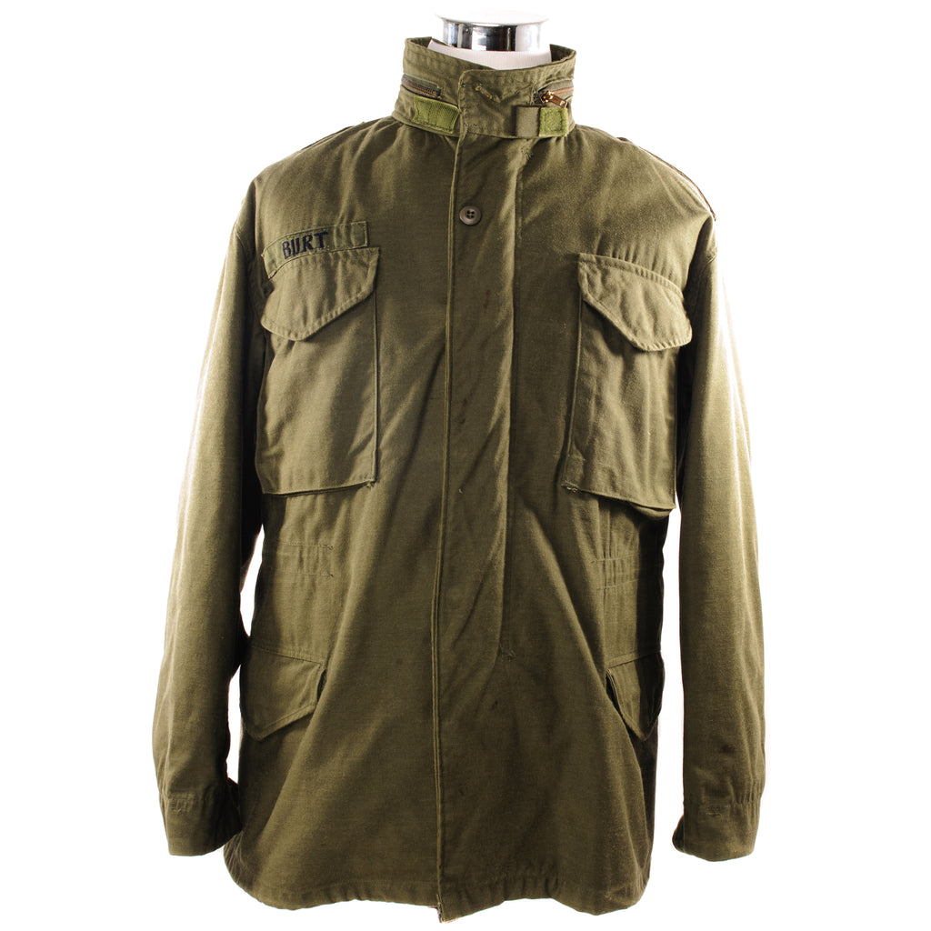 The M-65 field jacket was widely used by United States forces during the Vietnam War and became a classic used by the U.S. troops in several other wars all around the world.  The M-1965 jacket was initially designed by Alpha Industries and was made from OG-107 (Olive Green Shade 107) water repellent and wind resistant cotton-nylon sateen. The fabrics was made by Burlington Fabrics.